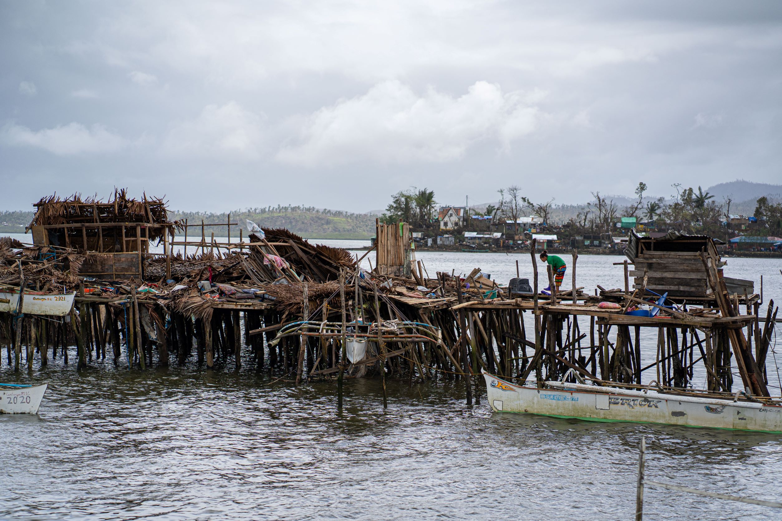 Out of the 92 houses in Surigao City’s Badjao community, only a few were left standing after Typhoon Odette. The families also lost 18 boats and their community school. ©UNICEF Philippines/2021/Louie Pacardo